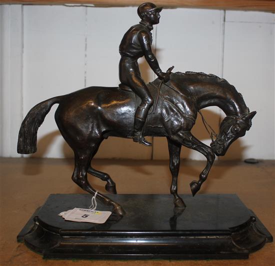 A 20th century bronze figure of a jockey and horse, 12in.